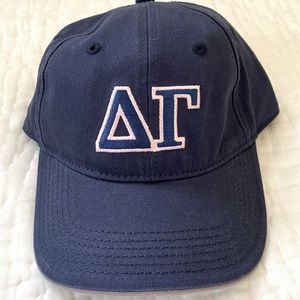 Casa Rojo Delta Gamma navy baseball hat.  Greek letters outlined in soft pink.